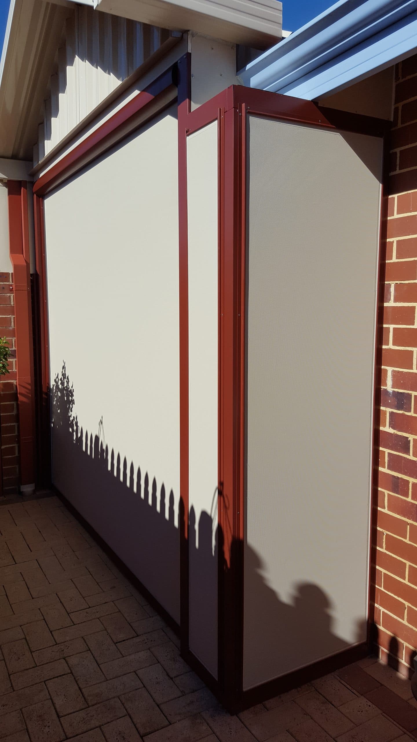 A Nustyle Galaxy blind and two small fixed panels on the side to enclose the patio area