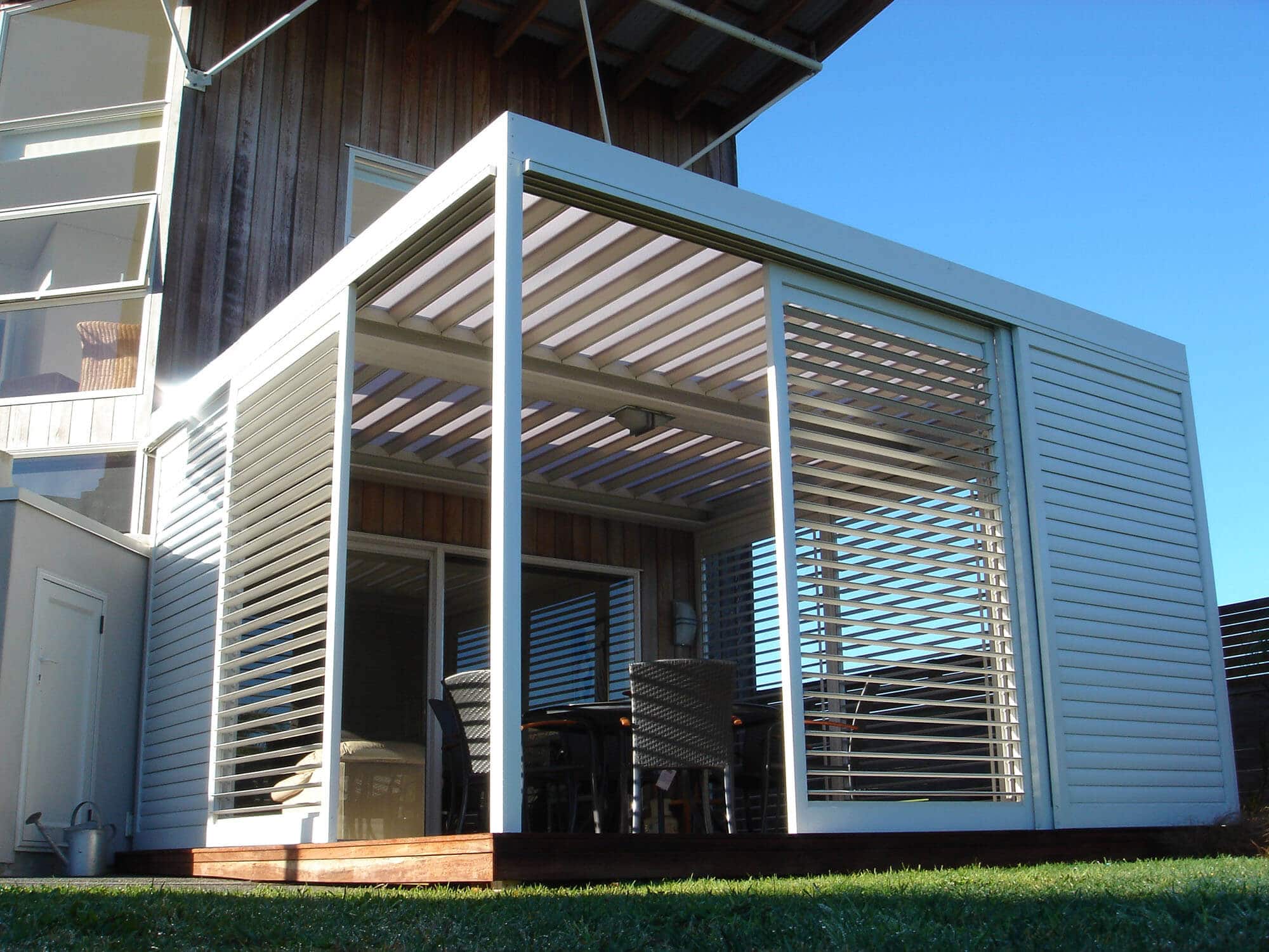 External outdoor aluminum plantation shutters fitted to patio