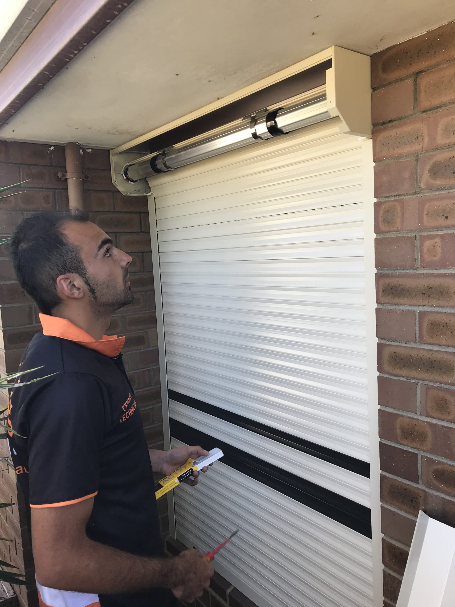 Roller Shutter being installed by Nu Style Shutters