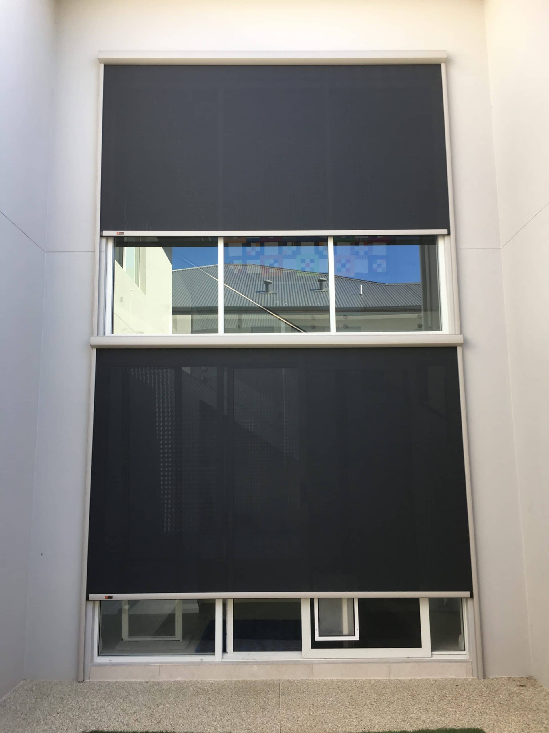 two galaxy external outdoor blinds over a tall window stairwell void