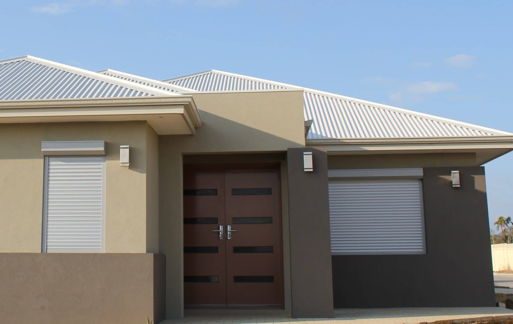 Front elevation of corner home, protected by Roller Shutters